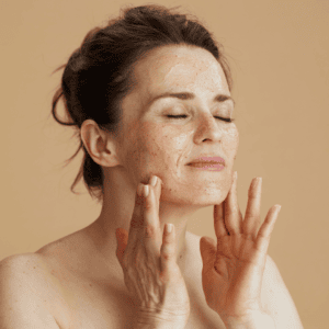Woman applying natural face cream as part of winter self care ritual